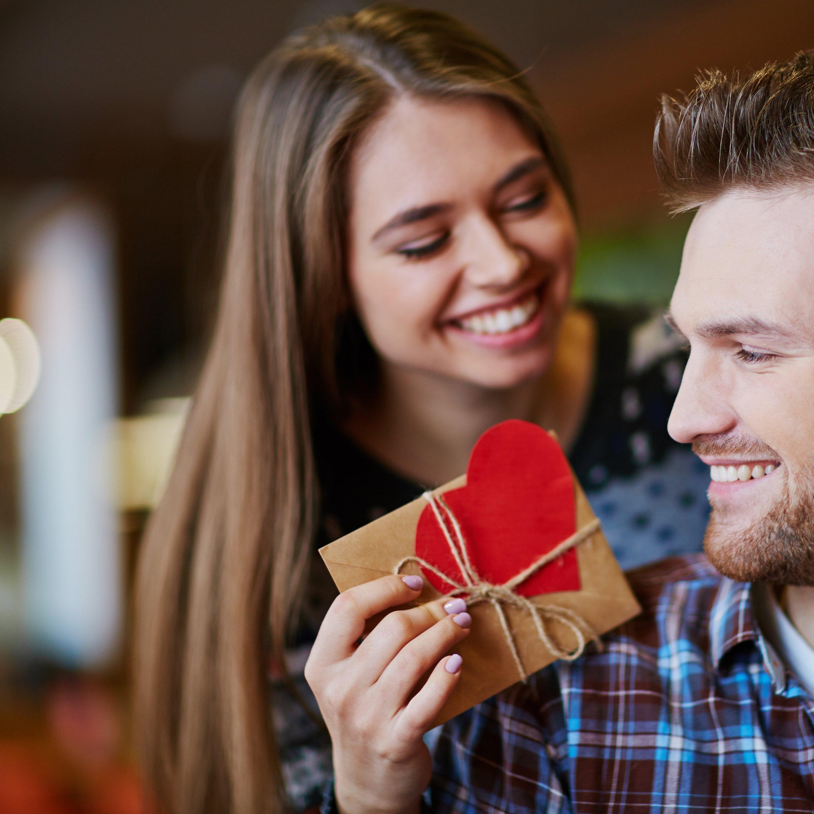 couple-smiling-giving-gifts